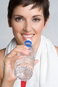 Woman holding water bottle.
